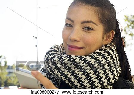 Young woman with smartphone View Large Photo Image Stock Photo - Young woman with smartphone. Fotosearch