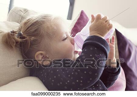 Baby girl drinking from bottle View Large Photo Image Stock Photography - Baby girl drinking from bottle. Fotosearch