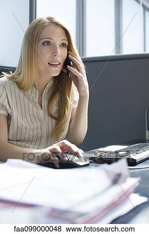 Businesswoman multitasking View Large Photo Image Stock Photo - Businesswoman multitasking. Fotosearch