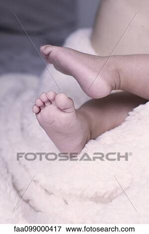Close-up of baby's bare feet View Large Photo Image Stock Photo - Close-up of baby's bare feet. Fotosearch