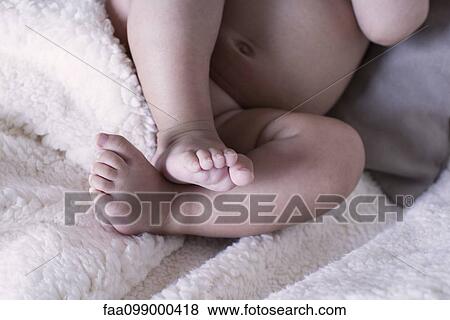 Close-up of baby's bare feet View Large Photo Image Stock Photo - Close-up of baby's bare feet. Fotosearch