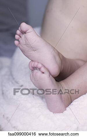 Close-up of baby's bare feet View Large Photo Image Stock Photograph - Close-up of baby's bare feet. Fotosearch