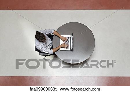 College student using laptop computer alone in breakroom View Large Photo Image Stock Photography - College student using laptop computer alone in breakroom. Fotosearch