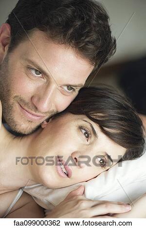 Couple in bed together comtemplating future plans View Large Photo Image Stock Image - Couple in bed together comtemplating future plans. Fotosearch