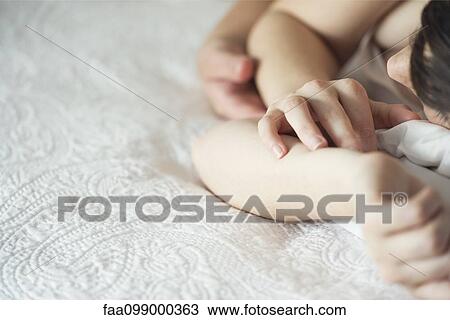 Stock Image - Couple sleeping together. Fotosearch