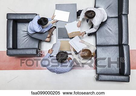 Executives in meeting, overhead view View Large Photo Image Stock Photography - Executives in meeting, overhead view. Fotosearch