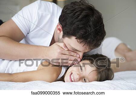 Father whispering to young daughter View Large Photo Image Stock Photography - Father whispering to young daughter. Fotosearch