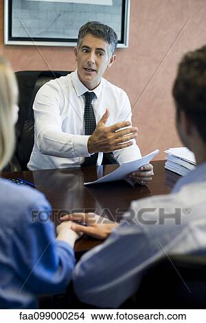 Financial advisor meeting with prospective clients View Large Photo Image Picture - Financial advisor meeting with prospective clients. Fotosearch