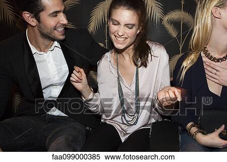 Friends partying at night club View Large Photo Image Stock Photography - Friends partying at night club. Fotosearch