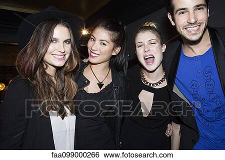 Friends posing for photo View Large Photo Image Stock Photograph - Friends posing for photo. Fotosearch