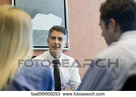 Insurance agent meeting with prospective clients View Large Photo Image Stock Image - Insurance agent meeting with prospective clients. Fotosearch