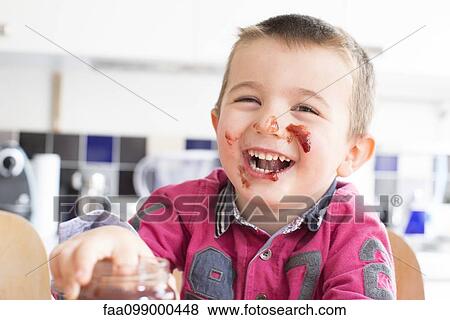 Little boy with jam on his face laughing View Large Photo Image Stock Photo - Little boy with jam on his face laughing. Fotosearch
