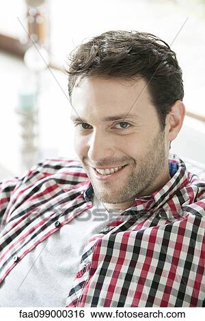 Stock Photograph - Man smiling, portrait. Fotosearch
