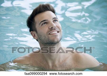Man swimming in pool, portrait View Large Photo Image Picture - Man swimming in pool, portrait. Fotosearch