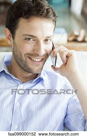 Man talking on cell phone, portrait View Large Photo Image Stock Image - Man talking on cell phone, portrait. Fotosearch