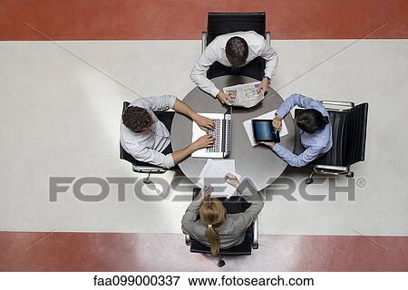 Office workers taking work into breakroom View Large Photo Image Stock Photo - Office workers taking work into breakroom. Fotosearch