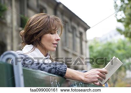 Tourist using guidebook View Large Photo Image Stock Image - Tourist using guidebook. Fotosearch