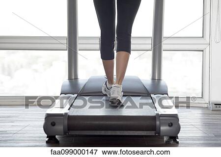Using treadmill View Large Photo Image Stock Photo - Using treadmill. Fotosearch