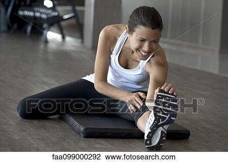 Warmup stretches help prevent injury while exercising View Large Photo Image Stock Image - Warmup stretches help prevent injury while exercising. Fotosearch
