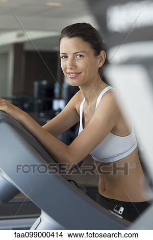 Woman exercising in health club, portrait View Large Photo Image Picture - Woman exercising in health club, portrait. Fotosearch