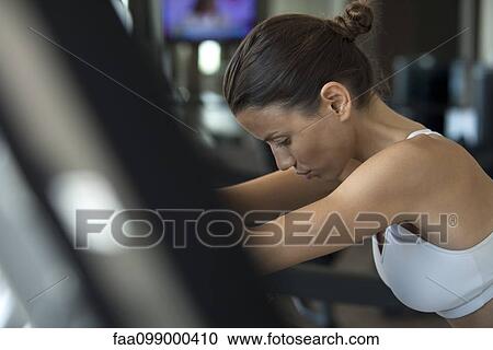 Woman exercising in health club View Large Photo Image Stock Image - Woman exercising in health club. Fotosearch