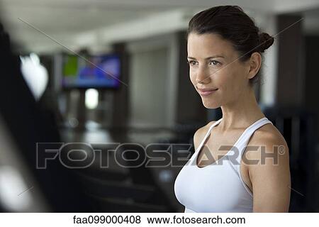 Woman exercising in health club View Large Photo Image Stock Photo - Woman exercising in health club. Fotosearch