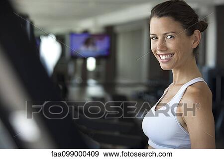 Woman exercising in health club, portrait View Large Photo Image Stock Photo - Woman exercising in health club, portrait. Fotosearch
