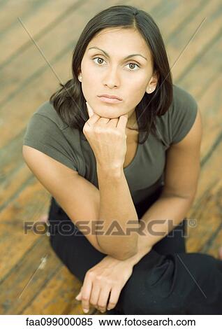 Woman holding head, portrait View Large Photo Image Stock Photography - Woman holding head, portrait. Fotosearch