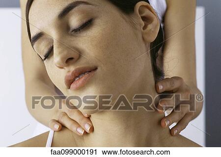 Stock Image - Woman receiving neck massage, close-up. Fotosearch