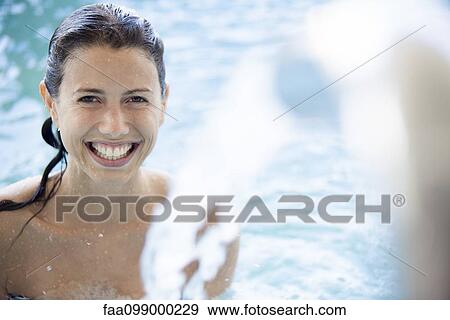Woman relaxing in pool View Large Photo Image Stock Photo - Woman relaxing in pool. Fotosearch