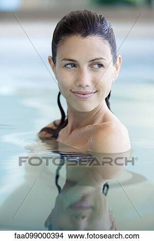 Woman relaxing in swimming pool View Large Photo Image Picture - Woman relaxing in swimming pool. Fotosearch