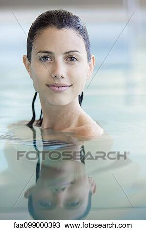 Woman relaxing in swimming pool, portrait View Large Photo Image Stock Image - Woman relaxing in swimming pool, portrait. Fotosearch