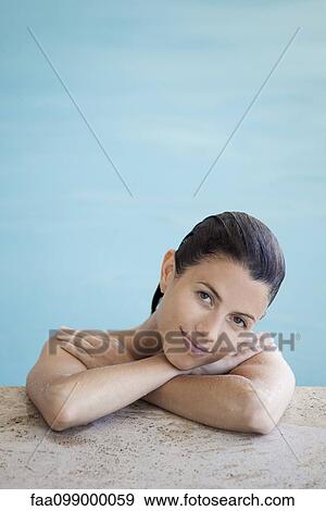 Woman relaxing in swimming pool, portrait View Large Photo Image Stock Photo - Woman relaxing in swimming pool, portrait. Fotosearch