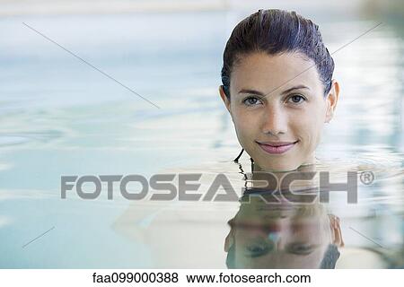 Woman relaxing in swimming pool, portrait View Large Photo Image Stock Photo - Woman relaxing in swimming pool, portrait. Fotosearch