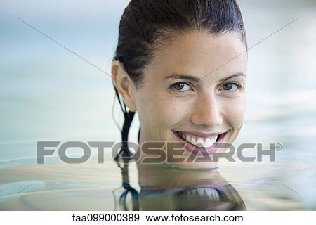 Woman relaxing in swimming pool, portrait View Large Photo Image Stock Photo - Woman relaxing in swimming pool, portrait. Fotosearch