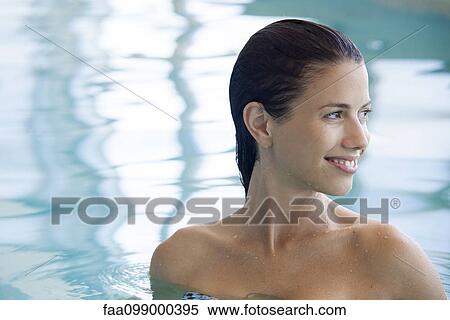 Woman relaxing in swimming pool View Large Photo Image Stock Photography - Woman relaxing in swimming pool. Fotosearch