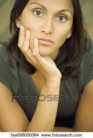 Woman resting chin on hand, portrait View Large Photo Image Picture - Woman resting chin on hand, portrait. Fotosearch
