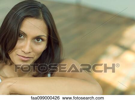 Stock Photograph - Woman smiling at camera, portrait. Fotosearch