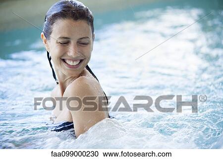 Woman swimming in pool View Large Photo Image Stock Image - Woman swimming in pool. Fotosearch