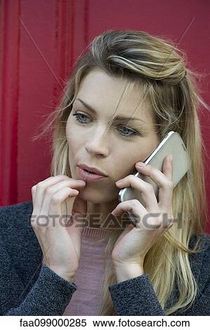 Woman using smartphone for phone call View Large Photo Image Stock Photography - Woman using smartphone for phone call. Fotosearch