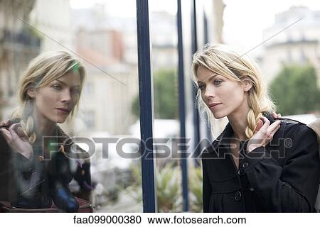 Woman window shopping View Large Photo Image Stock Image - Woman window shopping. Fotosearch