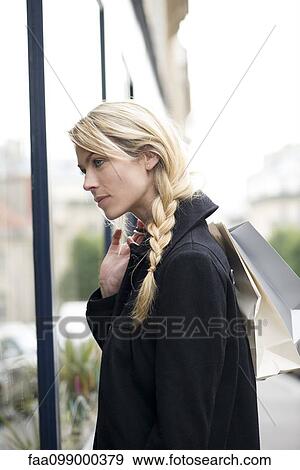 Stock Photo - Woman window shopping. Fotosearch