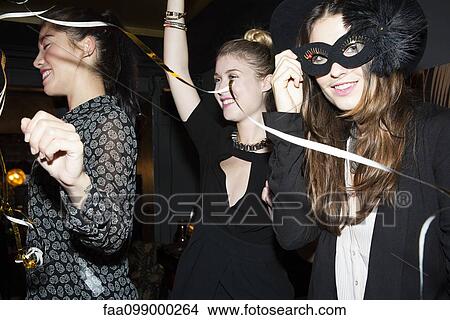 Picture - Women partying at night club. Fotosearch