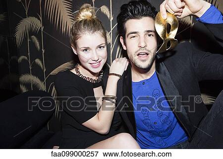 Stock Photo - Young couple at night club. Fotosearch
