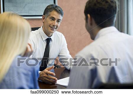 Young couple meeting with insurance agent View Large Photo Image Stock Image - Young couple meeting with insurance agent. Fotosearch