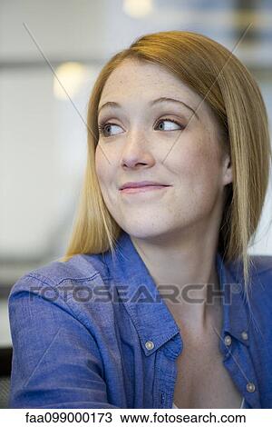 Young woman giving knowing look View Large Photo Image Stock Image - Young woman giving knowing look. Fotosearch