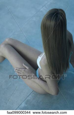 Young woman in bikini, elevated view View Large Photo Image Picture - Young woman in bikini, elevated view. Fotosearch