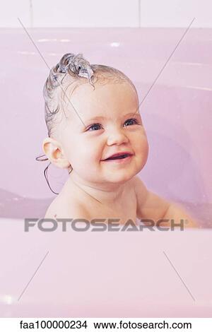 Picture - Baby girl in bath. Fotosearch