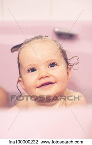 Baby girl in bath, portrait View Large Photo Image Stock Image - Baby girl in bath, portrait. Fotosearch
