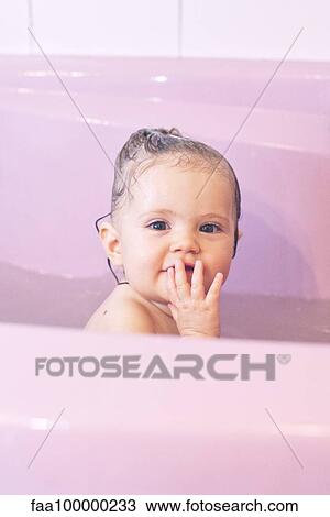 Baby girl taking a bath View Large Photo Image Stock Image - Baby girl taking a bath. Fotosearch